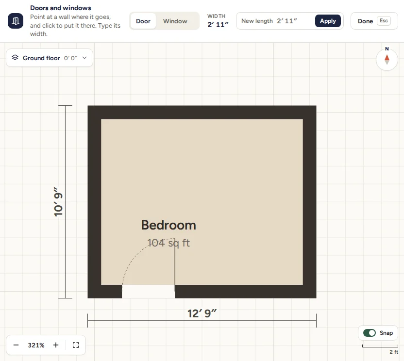The Doors and windows tool with Door chosen, and a door in the bottom wall of the bedroom, its swing drawn as an arc.